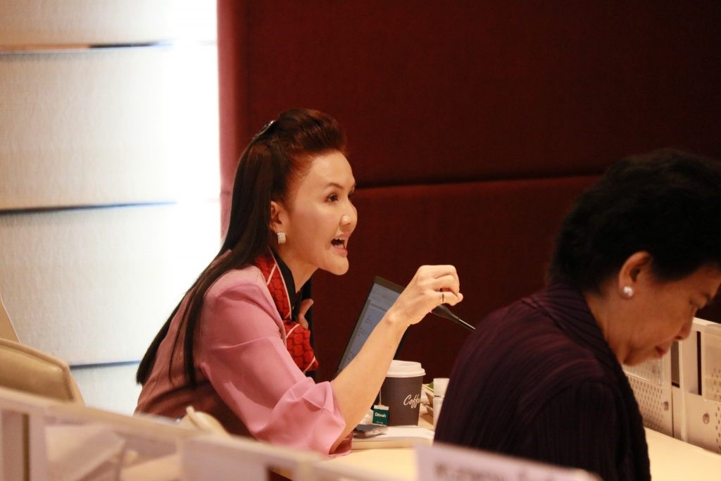 A group of people sitting at a table Description automatically generated