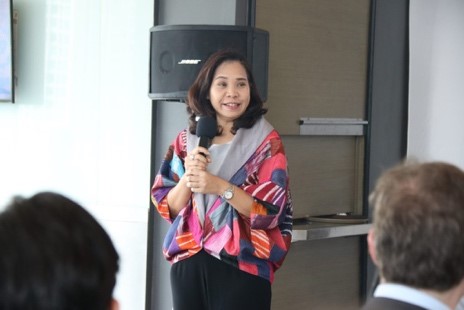A person speaking into a microphone Description automatically generated with medium confidence