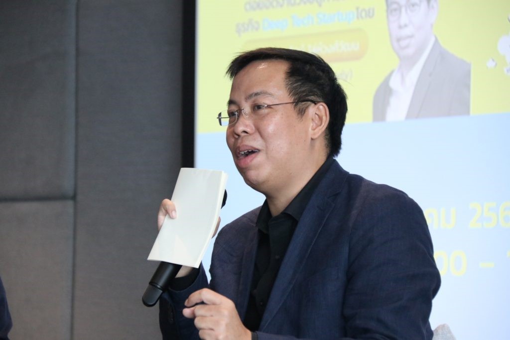 A person speaking into a microphone Description automatically generated with medium confidence
