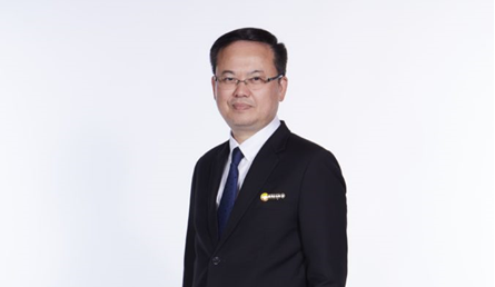 A person in a suit Description automatically generated with low confidence